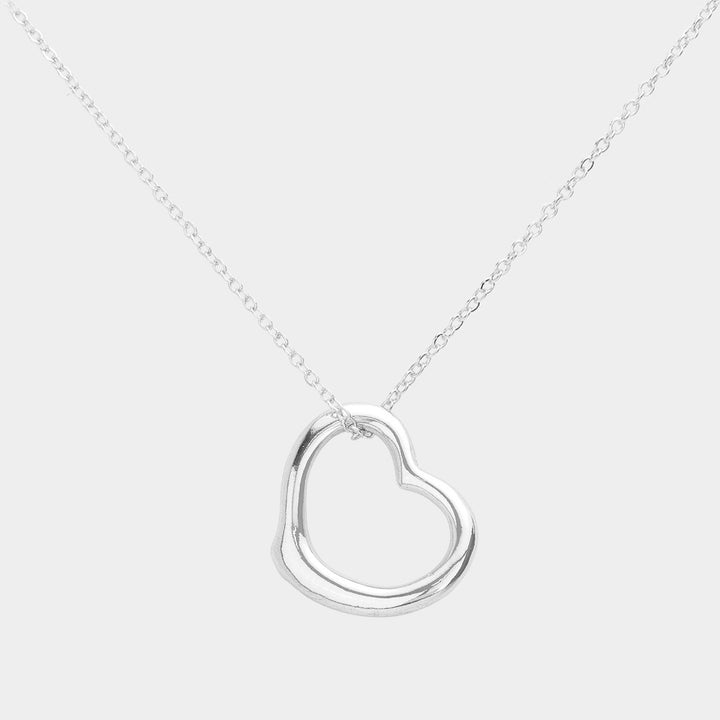 Silver Metal Heart Cut-Out Pendant Necklace showcases a modern cut-out design, adding a touch of elegance to any outfit. Made with high-quality materials, this necklace is both durable and stylish. Elevate your look with this versatile accessory that perfectly blends beauty and functionality. 