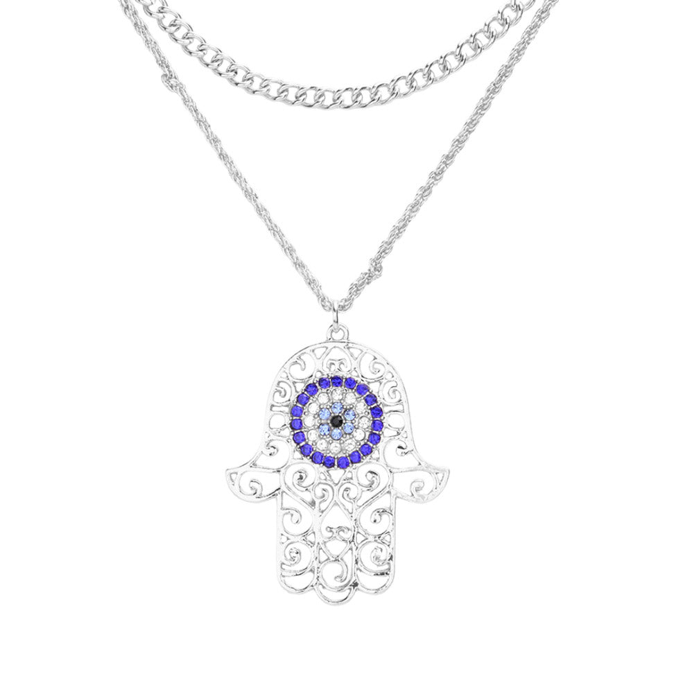 Ward off bad vibes in style with this Rhinestone Evil Eye Filigree Hamsa Pendant Layered Necklace! Featuring a sparkling evil eye and intricate filigree hamsa, it's the perfect way to protect yourself in a fashionable way. Perfect Birthday Gift, Anniversary Gift, Christmas Gift, Regalo Cumpleanos, Regalo Navidad, etc