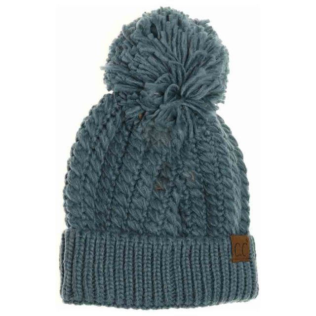 Steel-Blue-Twisted Mock Cable Knit Pom Beanie combines expert craftsmanship with timeless design. Featuring a textured twisted mock cable knit pattern, this beanie delivers both warmth and sophisticated style. Its soft fabric ensures comfortable wear, while the pom adds a refined yet playful detail. Ideal for cold-weather protection, this versatile accessory complements a range of outfits with ease. 