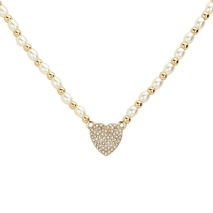 Stone Paved Heart Pendant Pearl Necklace adds a touch of elegance to any outfit. The intricately designed heart pendant is adorned with sparkling stones, accentuating the beauty of the lustrous pearl. This necklace is a must-have for any jewelry collection, perfect for formal and casual occasions. 