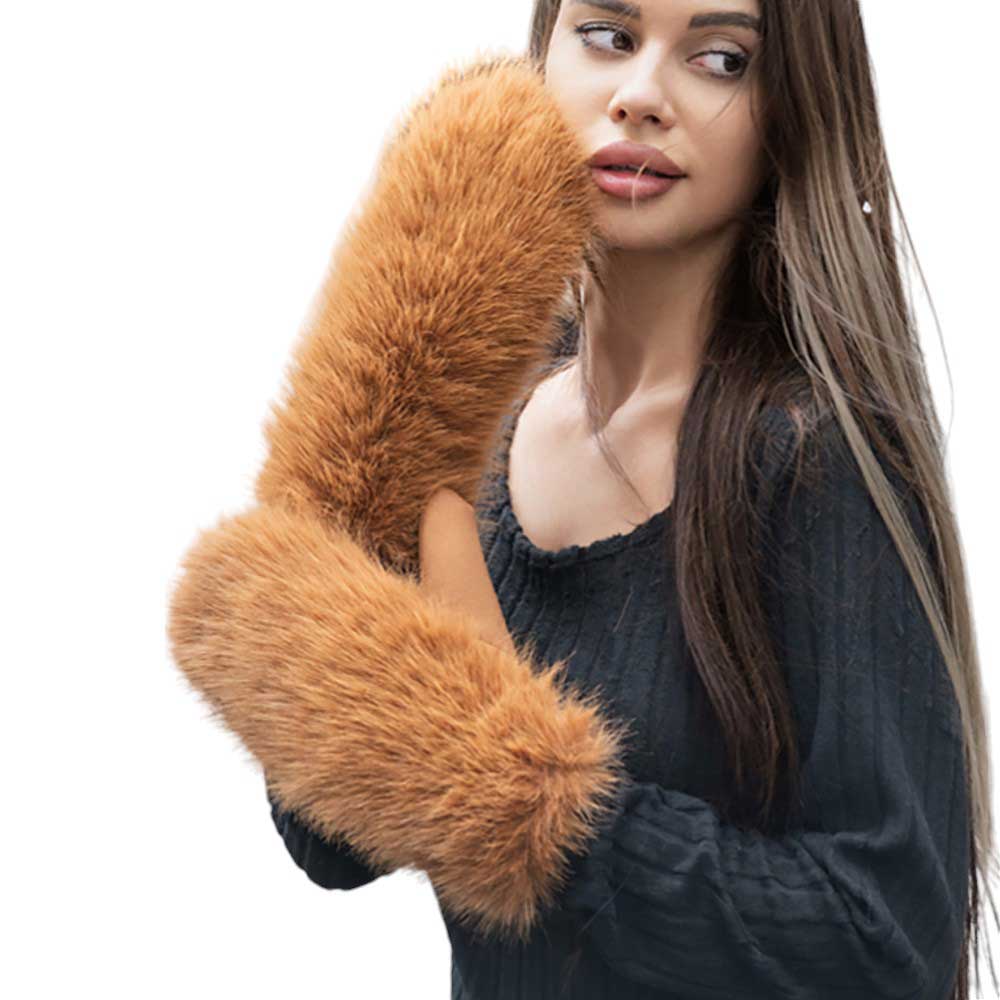 T^an-Faux Fuzzy Fur Mitten Gloves offer warmth and style in one. Made with soft, faux fur material, they are perfect for keeping your hands cozy during the colder months. With their unique mitten design, they provide added protection and functionality. Stay fashion-forward and comfortable with these must-have gloves. 