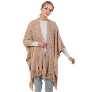 Taupe Cut Out Detailed Fringe Poncho, with the latest trend in ladies' outfit cover-up! The high-quality knit poncho is soft, comfortable, and warm but lightweight. It's perfect for your daily, casual, party, evening, vacation, and other special events outfits. A fantastic gift for your friends or family.