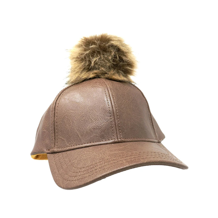 Taupe Faux Leather Fur Pom CC Ball Cap combines stylish design with expert craftsmanship. Featuring high-quality faux leather, this cap offers durability and a sleek appearance. The soft fur pom adds a sophisticated accent, enhancing its fashionable appeal. Designed for a comfortable fit, it’s perfect for those who want to elevate their casual outfits with a refined accessory. 