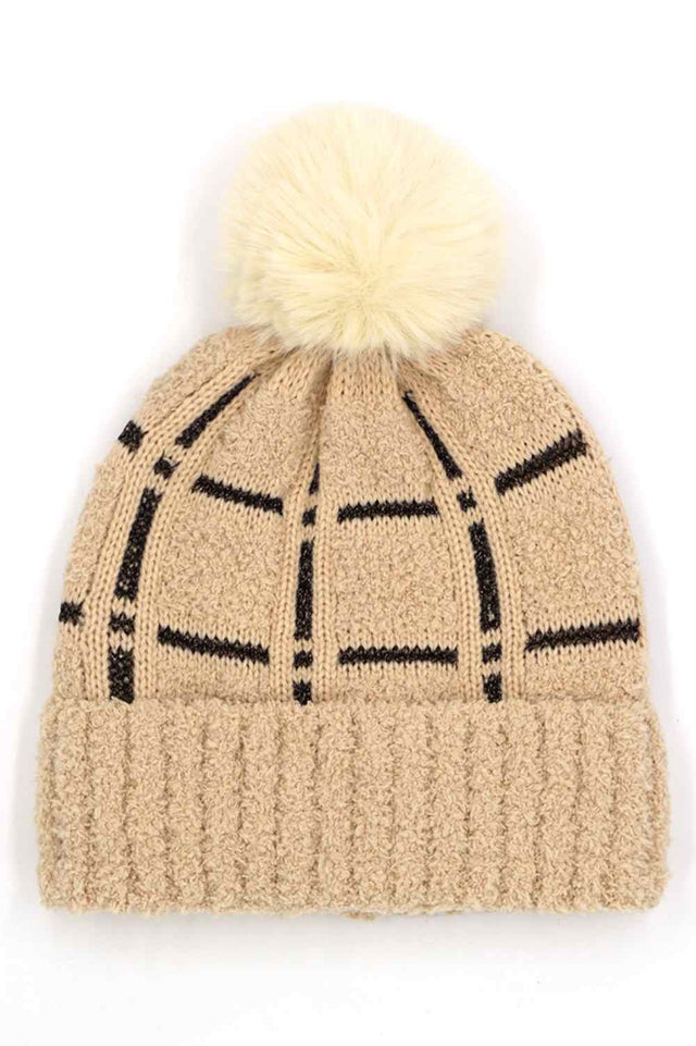 Taupe Plaid Pattern Pom Pom Beanie features a classic plaid knit design topped with a fluffy pom for a timeless, winter-ready look. Crafted with a soft stretch fit, it delivers cozy warmth while adding stylish charm to your cold-weather outfits.