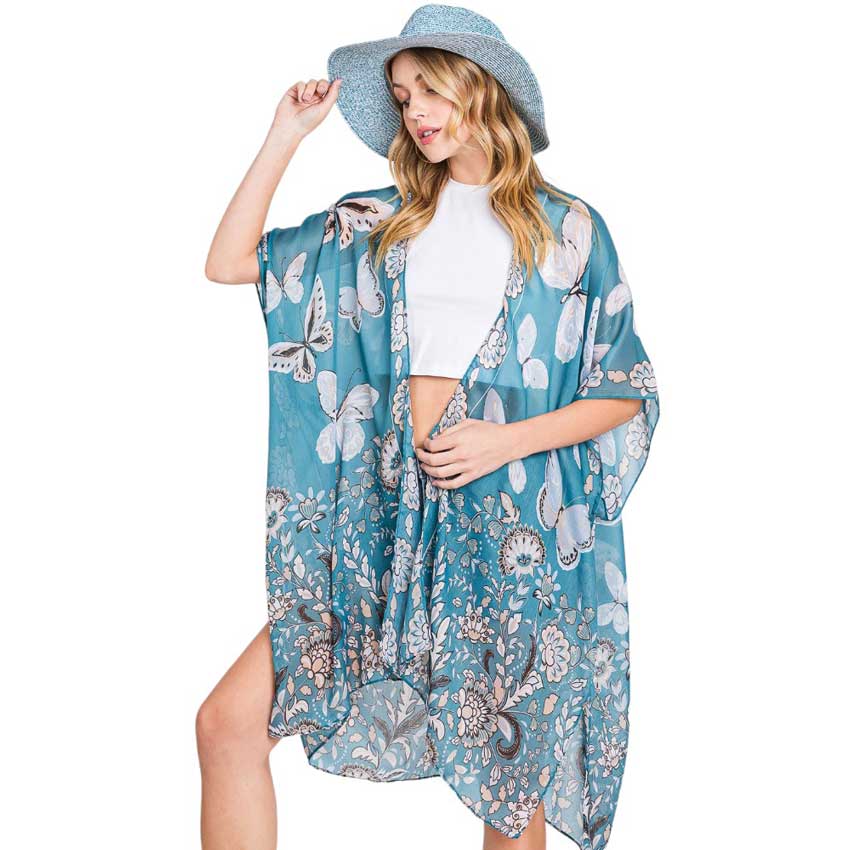Teal Butterfly and Flower Print Kimono Poncho, is a stylish addition to any wardrobe or a perfect gift. Made from high-quality materials, it features a beautiful butterfly and flower print that adds a touch of elegance to any outfit. Its versatile design allows for effortless layering, making it perfect for any occasion.