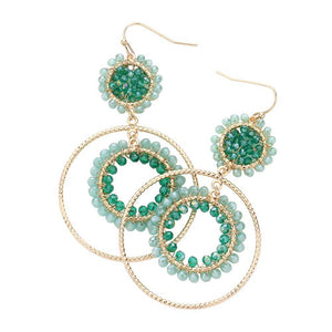 Teal Faceted Beaded Metallic Tiered Circle Dangle Earrings, will add a touch of subtle sparkle to your outfit. Crafted with a modern and eye-catching design, these earrings feature a faceted bead, a tiered circle, and a dangle pattern for a unique and stylish look. Perfect for either a special occasion or everyday wear.