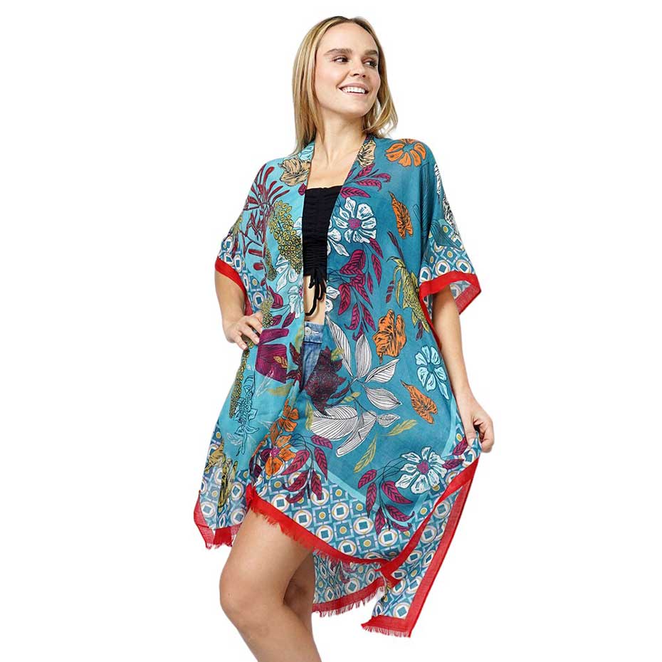 Teal Floral Print Kimono Poncho. Introducing our contemporary poncho, made from high-quality materials, this poncho features a stunning floral print that adds a touch of elegance to any outfit. With its versatile design, it can be worn as a kimono or a poncho, perfect for any occasion. Stay trendy and comfortable.