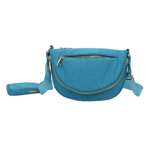 Teal Half Round Solid Nylon Crossbody Bag, is made of nylon, making it lightweight and durable. The adjustable shoulder strap ensures it will be comfortable to carry. The half-round shape adds a unique look to this bag, making it a great choice for any occasion. Perfect gift for fashion-forwarded family members and friends.