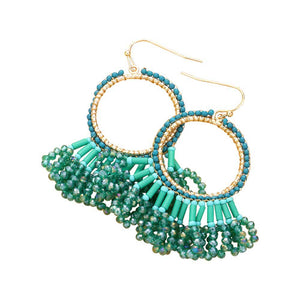 Teal Seed Beaded Fringe Metallic Tiered Circle Dangle Earrings, Inject some drama into your look with these stunning pieces. Crafted with layers of tiny seed beads and metallic circles, these beautiful earrings provide a unique and eye-catching addition to any outfit. A perfect accessory for any occasion.