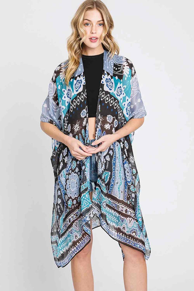 Teal Embrace effortless style with this Geometric Boho Print Kimono. Crafted from lightweight 100% polyester, this versatile piece features eye-catching geometric patterns inspired by bohemian design. Perfect for layering over dresses, swimwear, or casual outfits, it drapes beautifully with a relaxed fit. Measuring 35" x 36", it's designed to flatter most body types. Ideal for beach days, festivals, or adding a boho touch to your everyday wardrobe.