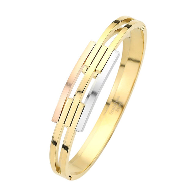 Three Tone Stainless steel three-tone hinged bangle bracelet is expertly crafted for a durable and stylish accessory. With its sturdy construction and three complementary tones, this bracelet is designed to add a touch of sophistication to any outfit. The hinged design allows for easy wear and removal, making it a convenient and versatile accessory.