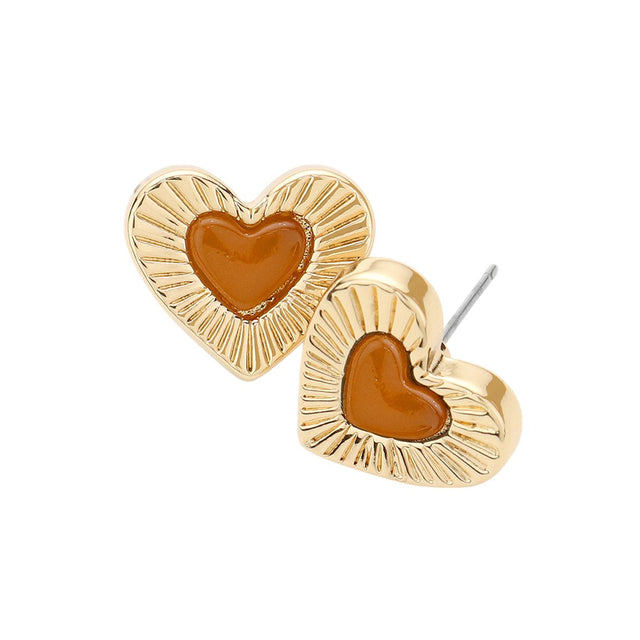Tortoise Celluloid Acetate Tortoise Heart Centred Stud Earrings offer a unique and stylish addition to any outfit. Made from high-quality celluloid acetate, these earrings are both durable and lightweight. The heart centre design adds a touch of elegance, making it the perfect accessory for any occasion.