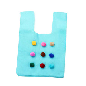 Turquoise Pom Pom Embellished Knit Tote Bag, is perfect for carrying your essentials. It is made of durable knit fabric and features fashionable pom pom details, making it a stylish and practical choice for daily use or as a thoughtful gift. It provides ample space to stow away your items, ideal for running errands or a day out.