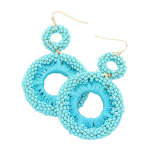 Turquoise Seed Beaded Raffia Wrapped Open O Link Dangle Earrings, Discover the perfect blend of style and sustainability with these. Crafted with natural raffia and intricately beaded, these earrings add a touch of bohemian chic to any outfit. Plus, with an open O link design, they're lightweight and comfortable to wear all day.