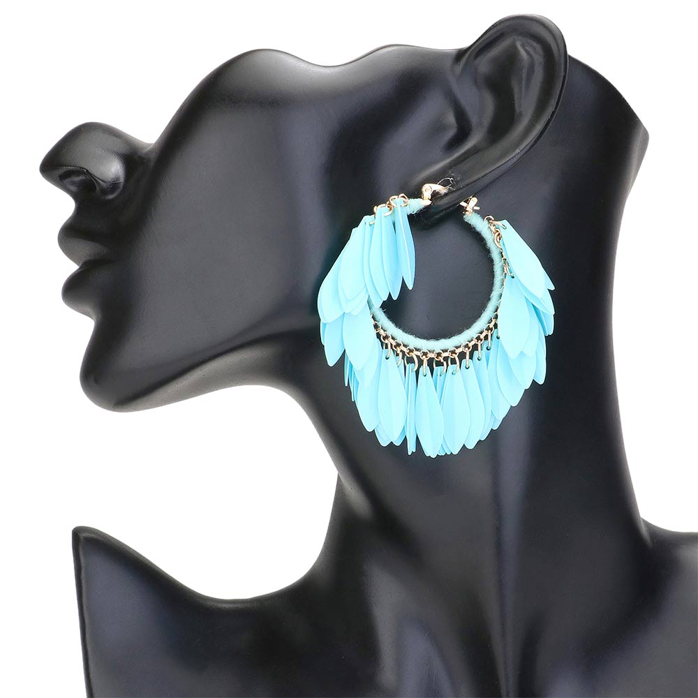 Turquoise Sequin Fringe Hoop Pin Catch Earrings add a touch of glamour to any outfit. The hoop design features cascading sequins for a chic and trendy look. The pin catch style ensures they will stay securely in place, making them perfect for a night out or special occasion. Ideal gift for any fashion forward individual.