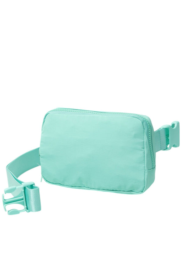 Solid Mini Fanny Belt Bag offers a compact and practical solution for hands-free carrying. Designed with durability and convenience in mind, its streamlined silhouette fits essentials securely while complementing a variety of styles. Ideal for active lifestyles, this belt bag ensures easy access and comfort without bulk, making it a versatile accessory for daily use or travel. 
