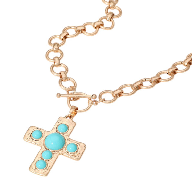 Turquoise Stone Cross Pendant Chunky Chain Necklace is the perfect accessory for adding a touch of bohemian style to any outfit. The stunning turquoise stone pendant adds a pop of color while the chunky chain brings a bold, statement-making look. Elevate your fashion game with this unique necklace. 