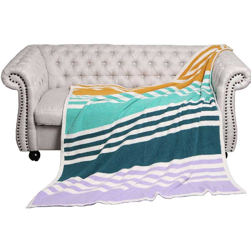 Ivory Striped Reversible Throw Blanket, Accent any living space with a touch of style. The soft fabric provides warmth and comfort that is perfect for relaxing days and nights. The reversible design showcases a striped pattern on one side and a solid color on the other. A thoughtful gift to Your family and friends. 