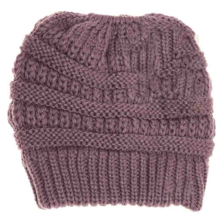 Violet Kids Solid Classic CC Beanie Tail combines timeless style with practical comfort. Designed with a soft, durable fabric, it provides warmth while allowing a ponytail or bun to fit through the open tail hole comfortably. Ideal for active children, this beanie ensures a secure and cozy fit during outdoor activities in cooler weather. Its solid color and classic design make it versatile for everyday wear or layering under helmets and hoods.