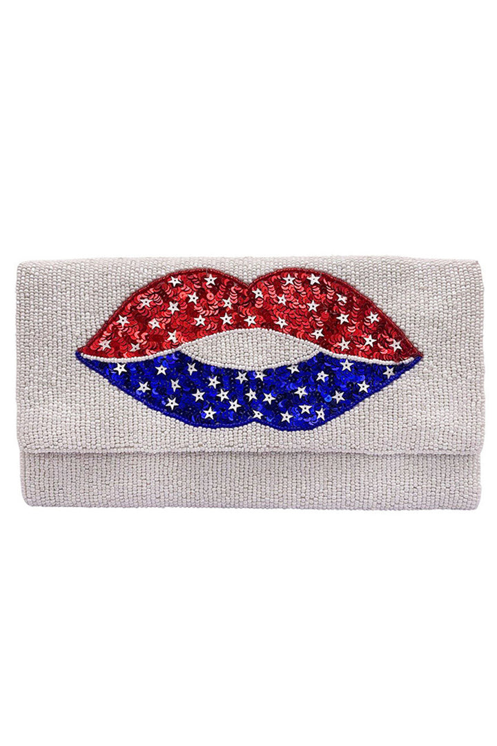 American Flag Lips Glass Beads Clutch combines patriotic design with sophisticated craftsmanship. Featuring intricate glass beadwork shaped into bold lips adorned with the American flag, this clutch offers a striking statement piece for formal events or special occasions. Its compact size ensures easy carrying while securely holding essentials, making it both a functional accessory and a unique expression of style and national pride. 