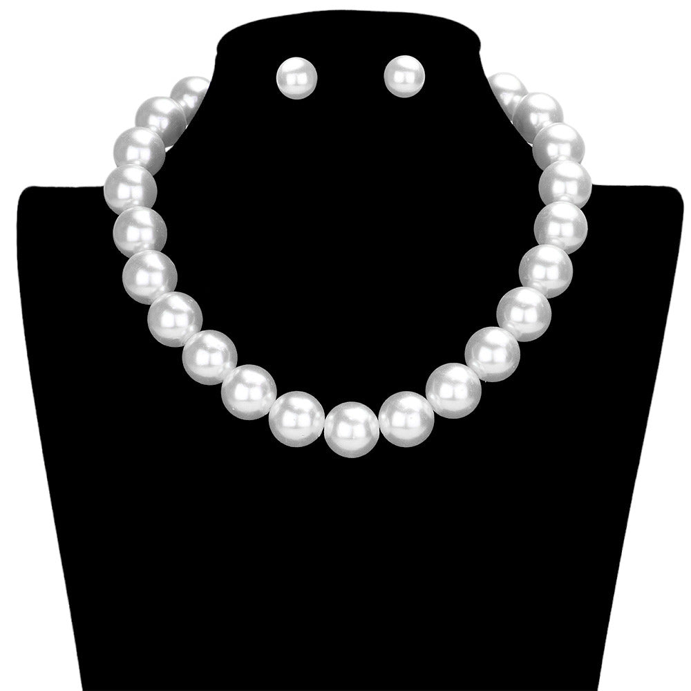 White This pearl necklace is crafted using high-quality pearls, strung together to create a timeless piece of jewelry with a classic Out of tine design. Its simple and elegant design makes it the perfect accessory for weddings, dinners, or any special occasion. Exquisite Gift item for any special occasion.