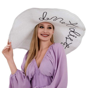 White Do Not Disturb Message Wide Brim Straw Sun Hat, Don't let anyone interrupt your sunny day vibes with this hat. With its wide brim and sturdy straw material, it's perfect for keeping you cool and protected from the sun. Plus, the playful message adds a touch of whimsy to your look. No interruptions allowed!