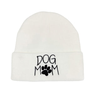 White Dog Mom Message Paw Pointed Solid Knit Beanie Hat, This adorable accessory not only keeps you warm but also proudly displays your status as a devoted dog mom. It's the perfect gift for the dog lover in your life, making chilly days a little brighter and a lot more fashionable.