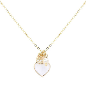 White Enamel Heart Pearl Pendant Necklace, is a stunning addition to any jewelry collection. With its delicate heart-shaped pendant and lustrous pearl, this necklace adds a touch of elegance to any outfit. Handcrafted with high-quality enamel and a pearl, this necklace is a timeless piece that is sure to impress.