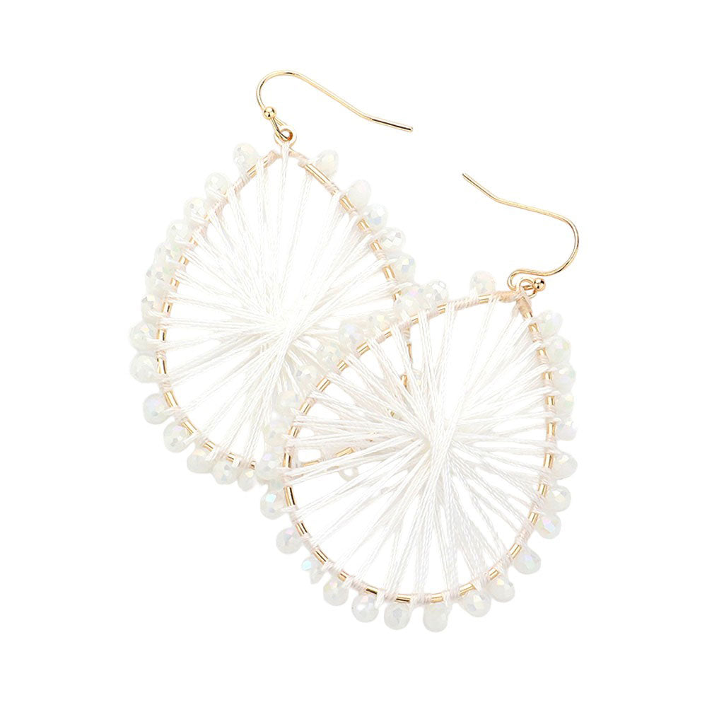 White Faceted Beaded Thread Wrapped Open Teardrop Dangle Earrings, Expertly crafted with faceted beads and wrapped in thread, these open teardrop dangle earrings are a stunning addition to any outfit. The unique design and high-quality materials make for a luxurious and eye-catching piece. Elevate your style with these.