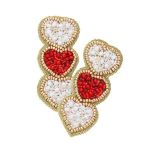 White Felt Back Triple Beaded Heart Earrings, are fun handcrafted jewelry that fits your lifestyle, adding a pop of pretty color. Take your love for statement accessorizing to a new level of affection with these beautiful earrings! Highlight your appearance, and grasp everyone's eye at any party or any occasion.