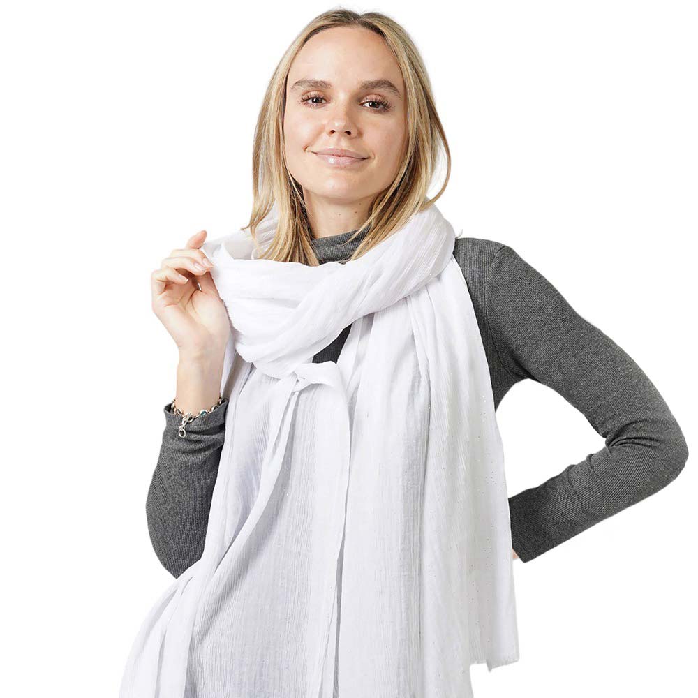 White Glittered Crinkle Scarf, this timeless glittered crinkle scarf is a soft, lightweight, and breathable fabric, close to the skin, and comfortable to wear. Sophisticated, flattering, and cozy. Look perfectly breezy and laid-back as you head to the beach. Perfect gift for birthdays, holidays, or fun nights out.