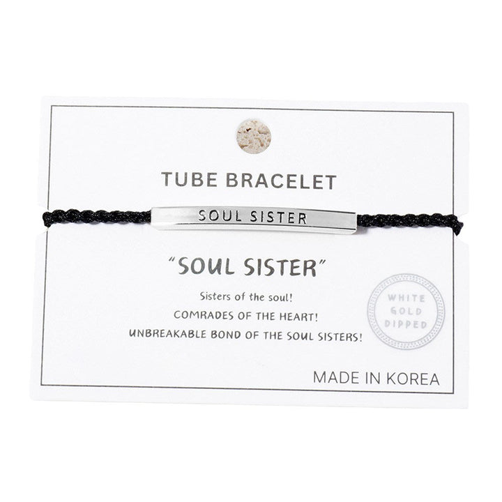 White-Gold-Dipped SOUL SISTER Message Bar Pointed Rope Adjustable Cinch Pull Tie Bracelet is a stylish and meaningful addition to any outfit. With its adjustable cinch pull tie, it can easily fit any wrist size. The dipped bar features the message "SOUL SISTER", making it the perfect gift for a special friend. 