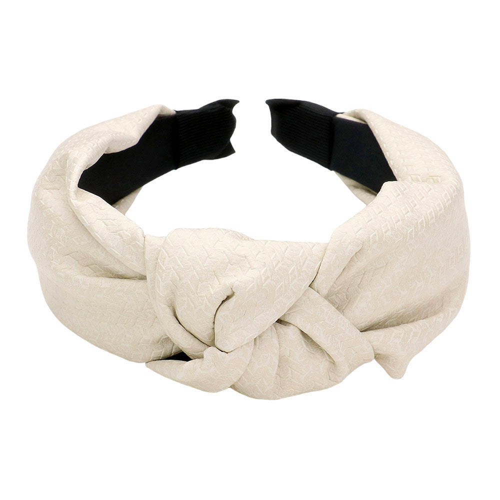 White Pattern Detailed Solid Faux Leather Knot Burnout Headband, Look great every day with this. This headband features a pattern-detailed solid faux leather design, along with a knot and burnout effect for a stylish look. A thoughtful gift item for young adults, friends, family members, and yourself.