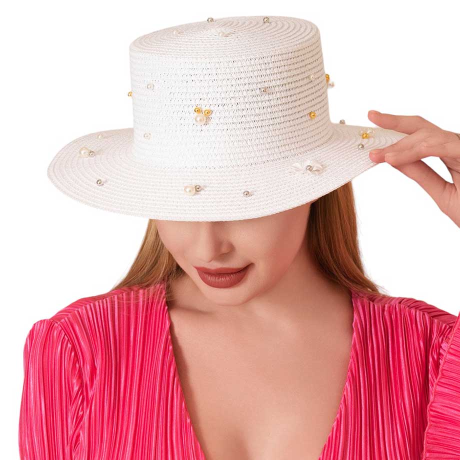 White Pearl Flower Embellished Straw Sun Hat, is a must-have for any fashion-forward individual! The beautifully crafted pearl flower detailing adds a touch of elegance to the classic straw sun hat. Protect your skin from the sun's harmful rays while looking stylish and chic. Perfect for any outdoor occasion! 