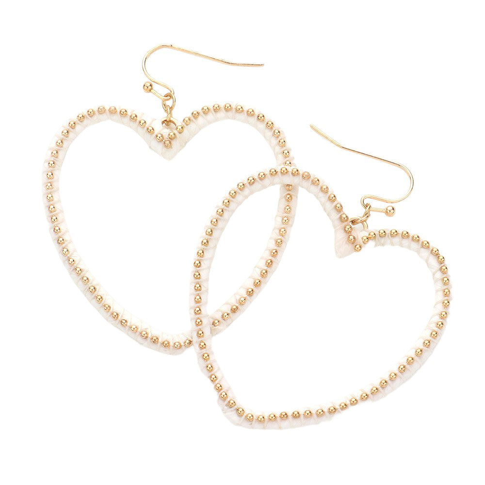 White Raffia Metal Ball Wrapped Open Heart Dangle Earrings, Expertly crafted with a unique design, these earrings are perfect for any occasion. The intricate metal wrapping around the raffia balls adds a touch of sophistication, while the open heart shape adds a delicate and feminine touch. Elevate your style with these.