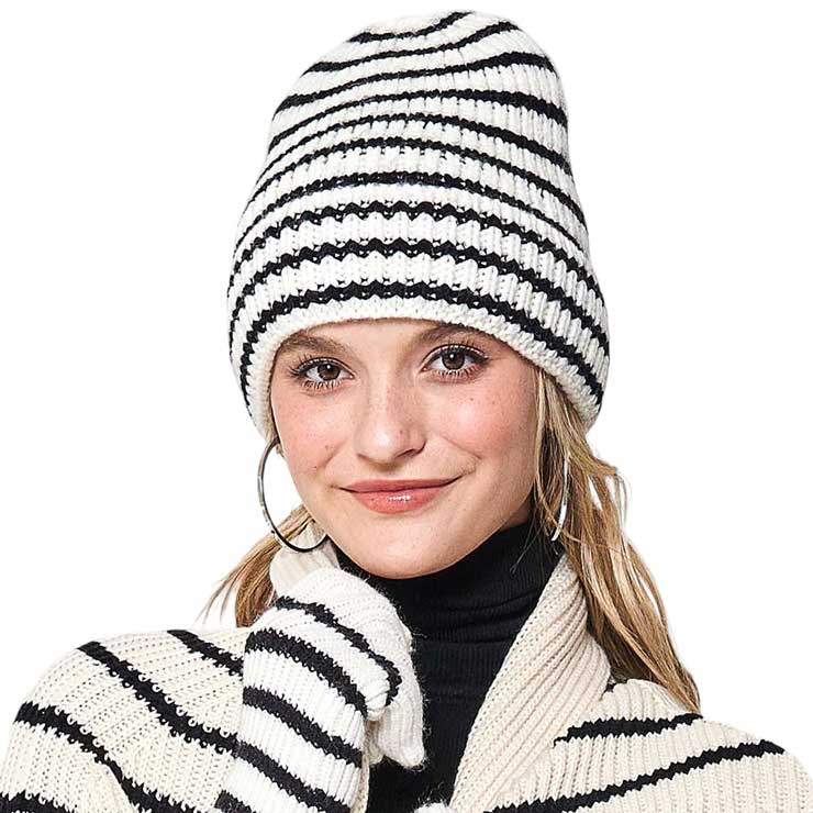 Black Striped Knit Beanie Hat. Stay warm and fashionable in any weather with this. Crafted from soft acrylic yarn, this beanie is designed to keep you warm and cozy. The textured striped knit pattern creates a unique and stylish look that's perfect for any occasion. Ideal gift item on cold days for your loved ones. 