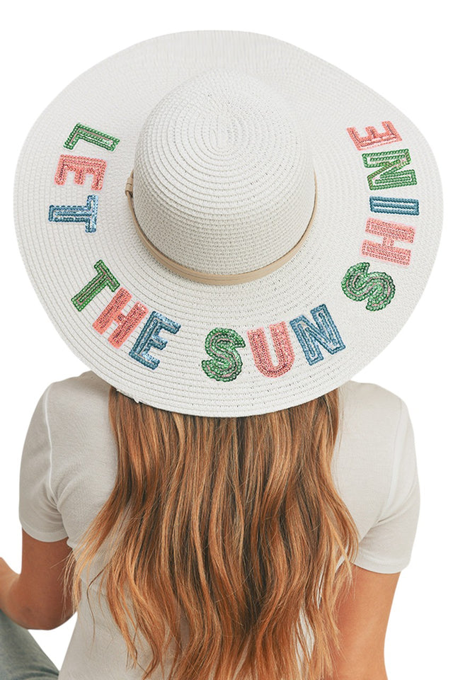 White THE SUNS SHINE Sequin Letter Floppy Hat combines superior sun protection with elegant design. The wide-brimmed silhouette features precision-applied sequin lettering that catches light beautifully while maintaining structural integrity throughout wear. Constructed with advanced materials that offer UPF protection without compromising on breathability or comfort. An essential accessory for discerning customers seeking both functionality and refined aesthetics.
