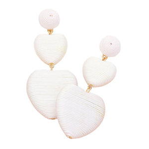 White Thread Wrapped Double Heart Dropdown Earrings are a versatile and stylish addition to any jewelry collection. The unique design features two intertwined hearts, symbolizing love and unity. Crafted with high-quality materials, these earrings are lightweight and comfortable to wear. Perfect for any occasion or daily wear