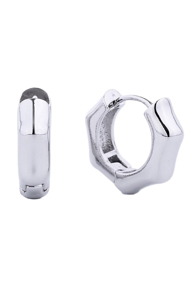 White Gold Delicate and timeless, these 14K gold dipped huggie hoop earrings offer everyday elegance in a compact 1.4cm diameter. Crafted from hypoallergenic brass, they're gentle on sensitive skin while delivering a luxurious gold finish. Lead and nickel compliant for peace of mind. Perfect for layering or wearing solo, these versatile hoops complement any style.