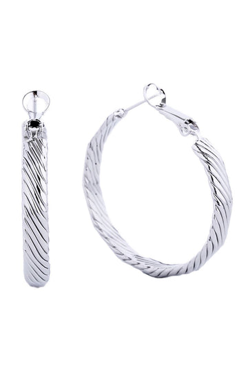White Gold Elegant hoop earrings crafted from hypoallergenic brass with a luxurious 14K gold and white dip finish. Featuring a secure omega closure for all-day wear, these 3.5cm diameter hoops offer timeless style with modern comfort. Lead and nickel compliant, making them perfect for sensitive skin. A versatile essential that transitions effortlessly from casual to formal occasions.