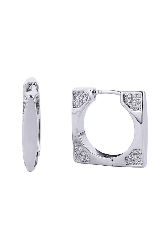 White Gold Timeless sophistication meets modern comfort in these 14K gold and white dipped huggie hoops. Each earring features brilliant cubic zirconia pavé work that catches light beautifully, while the compact 1.78cm diameter keeps them effortlessly wearable for any occasion. Built from durable brass with a hypoallergenic design, these earrings are lead and nickel compliant ideal for sensitive ears.