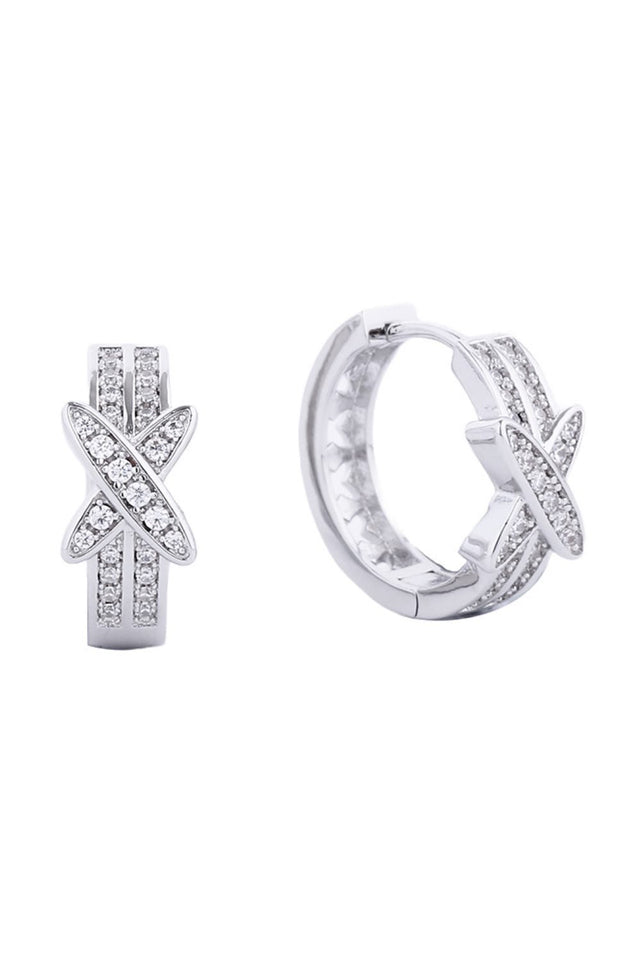 White Gold Elegant huggie hoop earrings featuring a luxurious 14K gold and white dip finish. Adorned with sparkling cubic zirconia pavé detailing for a sophisticated sparkle that catches the light beautifully. Crafted from quality brass with hypoallergenic properties, these earrings are gentle on sensitive ears. Measuring 1.78cm in diameter, they offer the perfect compact size for everyday wear or layering. Lead and nickel compliant, ensuring safety and comfort. A timeless accessory that transitions seamles