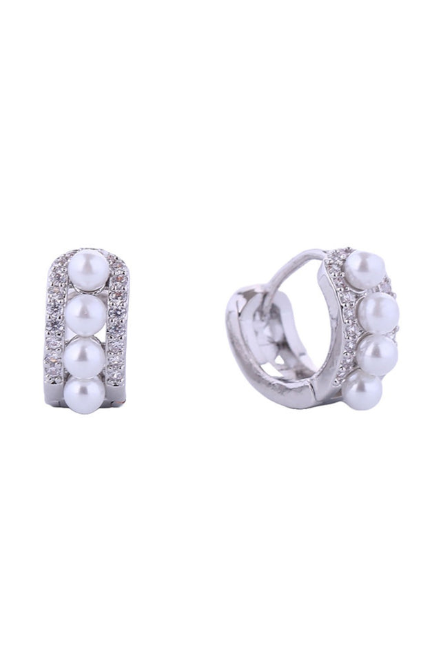 White Gold Delicate pearl eternity huggie earrings crafted in 14K gold and white gold-dipped brass. These petite 1.2cm hoops feature lustrous pearls set in a continuous design, perfect for everyday elegance or layering. Hypoallergenic construction ensures comfort for sensitive ears. Lead and nickel compliant for peace of mind. Expertly made in Korea with attention to quality craftsmanship. A versatile essential that transitions seamlessly from day to night.