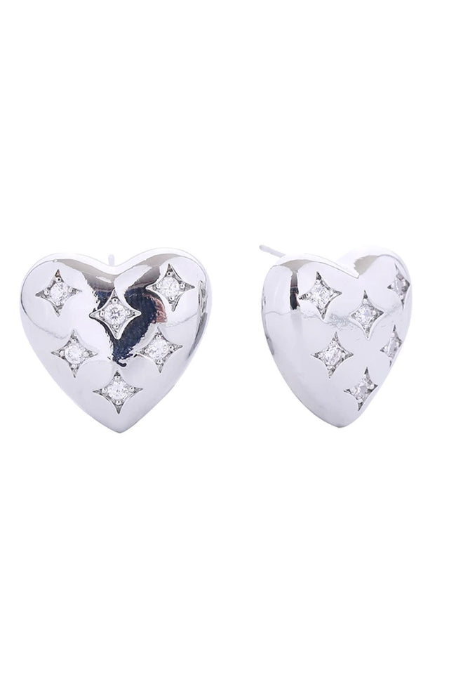 White Gold Elevate your everyday look with these charming 14K Gold/White Gold Dipped Puffy Heart Post Earrings. Crafted from quality brass and adorned with sparkling cubic zirconia, these delicate studs offer timeless elegance with a modern twist. At just 2cm, they're the perfect size for subtle sophistication. The hypoallergenic design ensures comfort for sensitive ears, while lead and nickel compliance guarantees safety and peace of mind.