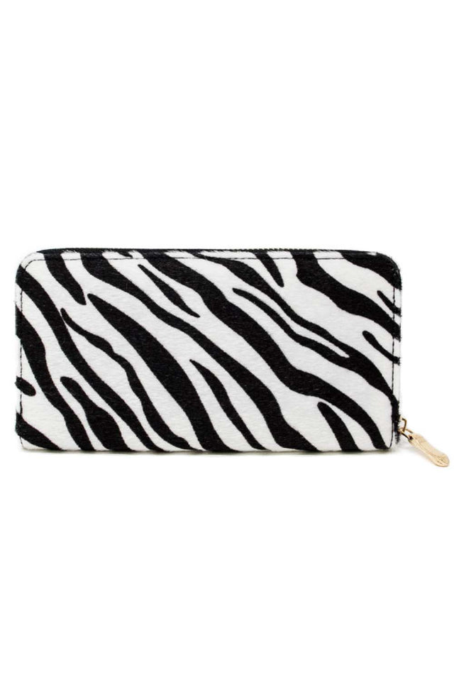 White Make a bold statement with this eye-catching Zebra Print Faux Fur Wallet. Crafted from soft, luxurious 100% polyester faux fur, it combines style with everyday functionality. The compact 7.5" x 3.7" size fits perfectly in your pocket or bag, while the striking zebra print adds personality to any outfit. Perfect for keeping your cards, cash, and essentials organized in style.