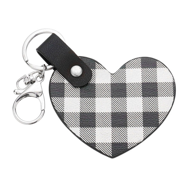 White Buffalo Check Patterned Faux Leather Heart Bag Charm features a trendy buffalo check pattern and a heart-shaped design, adding a touch of style to any handbag. Made from durable faux leather, this charm is both fashionable and functional. Perfect for those who love to accessorize with unique pieces!