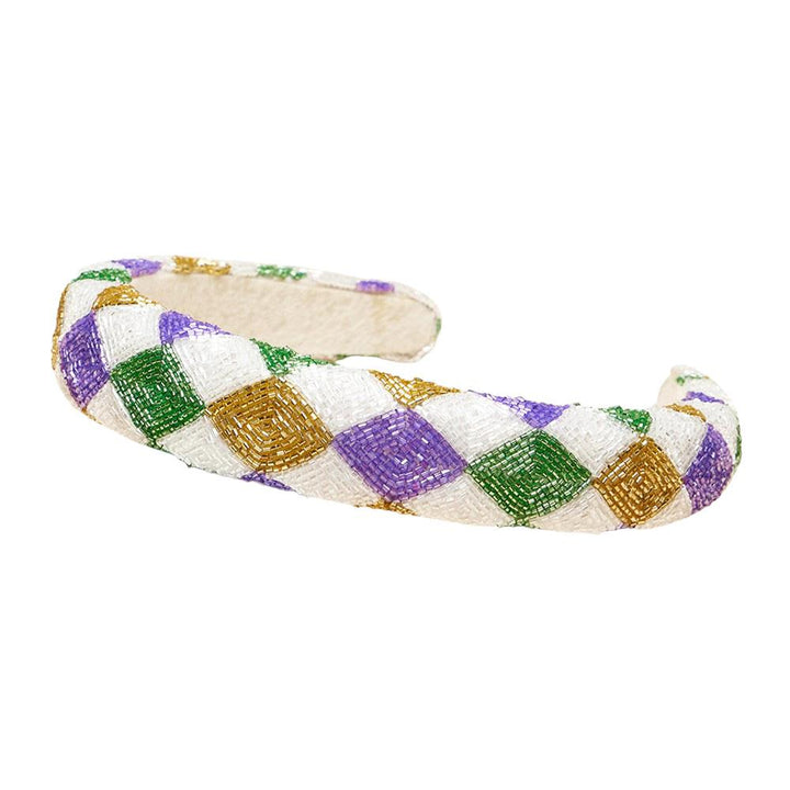 Mardi Gras Seed Beaded Headband is a must-have accessory for festive celebrations. Crafted with vibrant, colorful beads in traditional Mardi Gras hues, it adds a touch of fun and flair to any outfit. Ideal for parades, parties, and other special occasions, it’s perfect for elevating your festive style. 