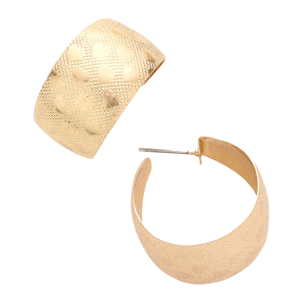 Worn Gold Heart Patterned Bold Metal Hoop Earrings, turn your ears into a chic fashion statement with these hoop earrings! The beautifully crafted design adds a gorgeous glow to any outfit. Put on a pop of color to complete your ensemble in perfect style. These adorable heart-patterned bold metal hoop earrings are bound to cause a smile.