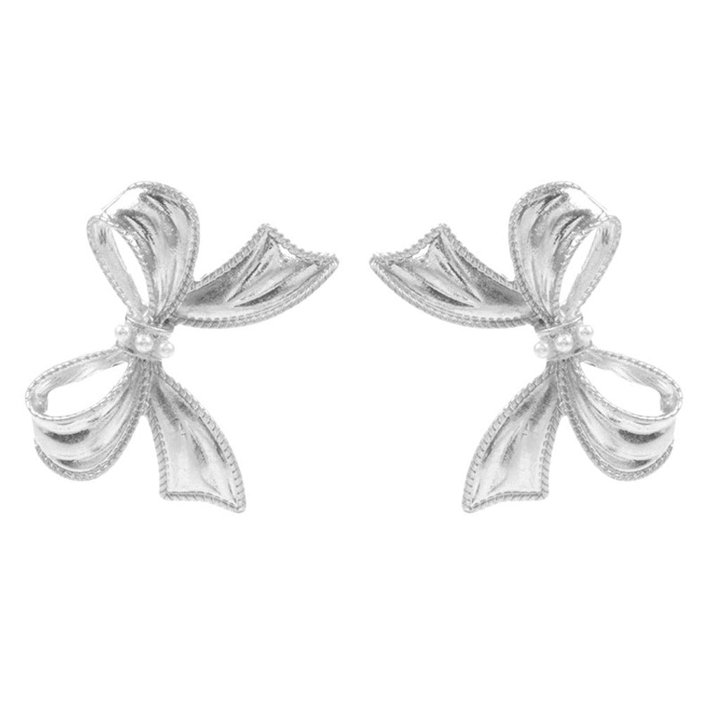 Silver Pearl Pointed Metal Bow Earrings, Crafted with precision and elegance, these earrings are a must-have for any fashion-forward individual. Made with genuine pearls and a metal bow design, these earrings are the perfect accessory for a touch of timeless sophistication. Elevate any outfit with these stunning earrings.