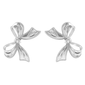 Silver Pearl Pointed Metal Bow Earrings, Crafted with precision and elegance, these earrings are a must-have for any fashion-forward individual. Made with genuine pearls and a metal bow design, these earrings are the perfect accessory for a touch of timeless sophistication. Elevate any outfit with these stunning earrings.